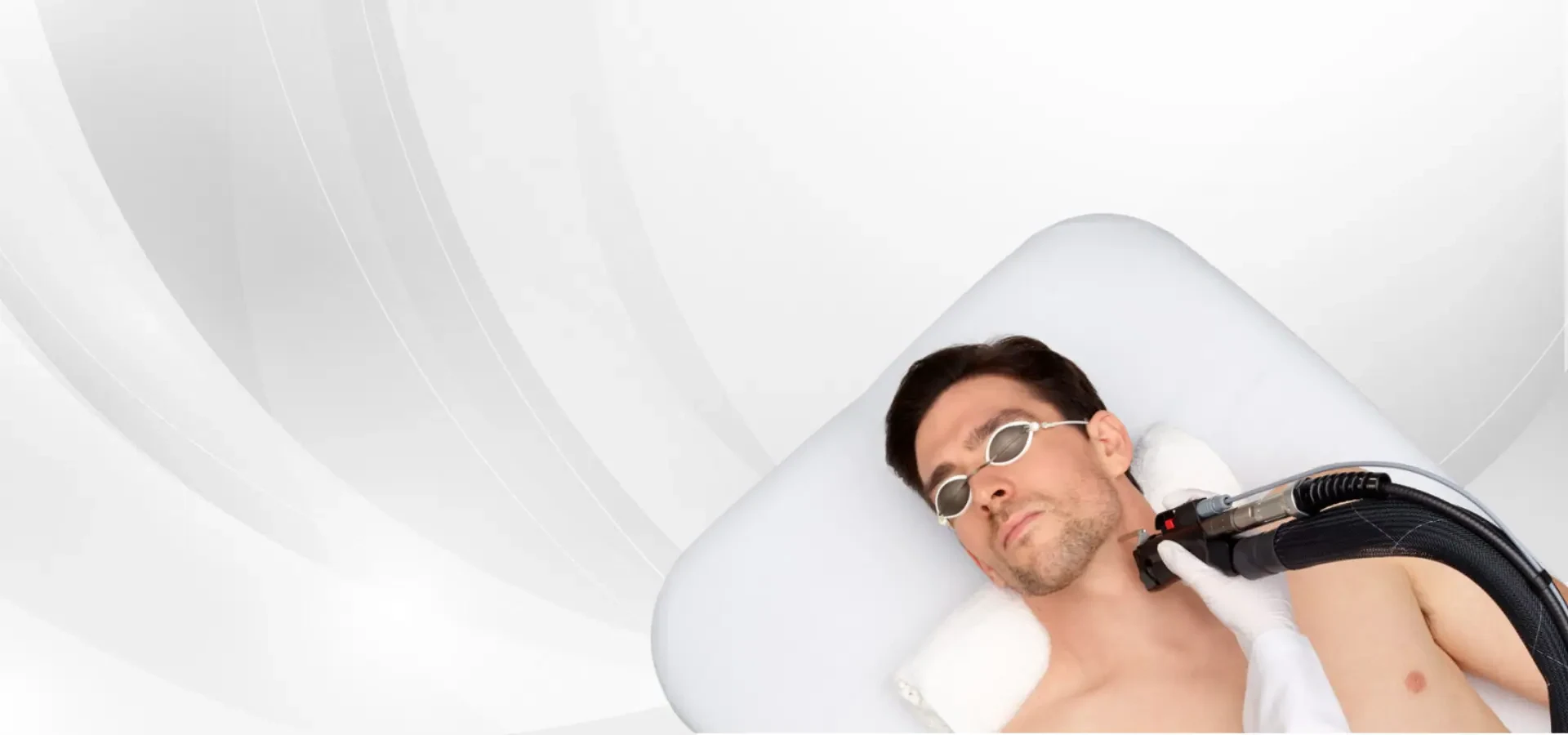 A client wearing protective eyewear during an Elite iQ laser session